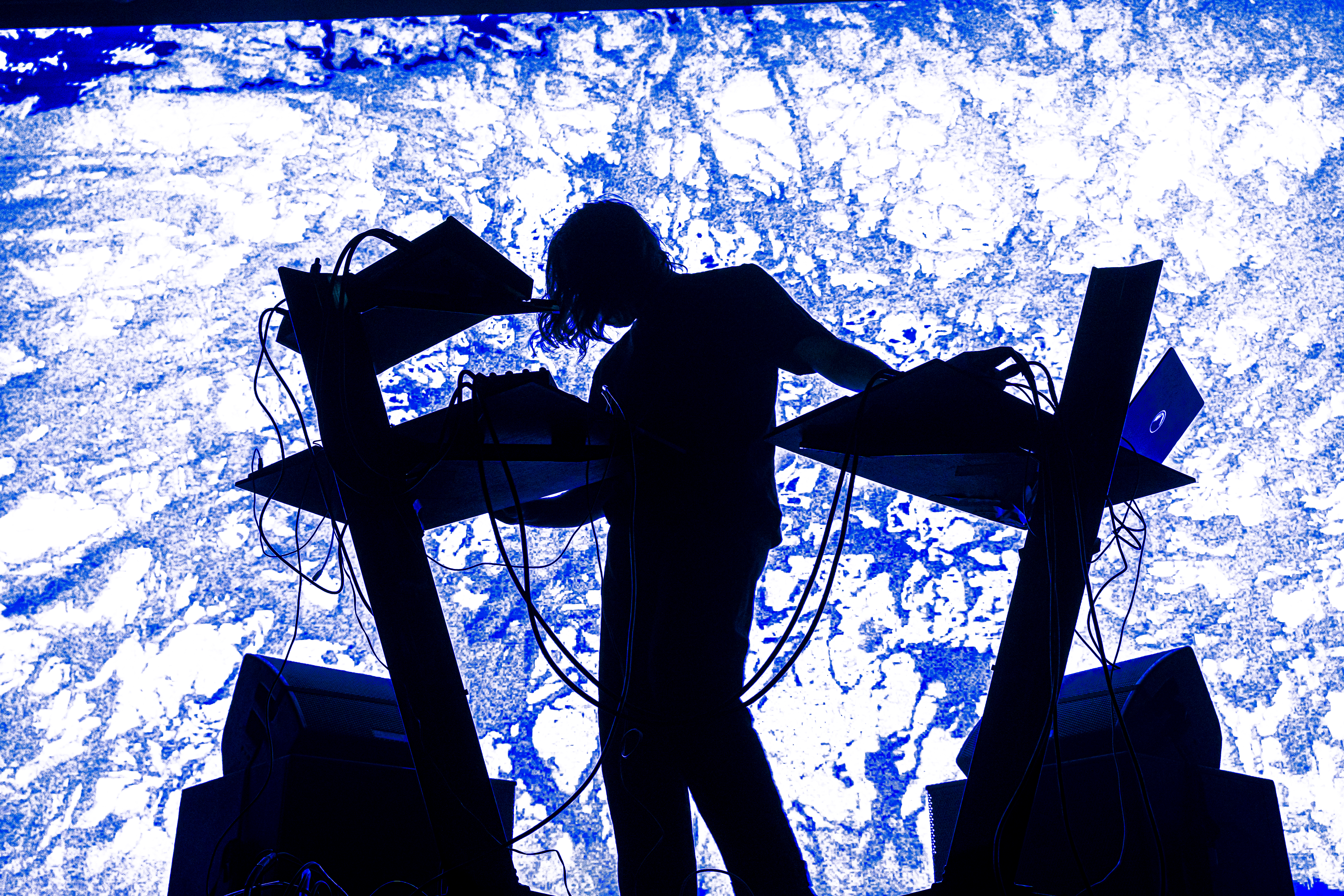 Live concert photography capturing musicians performing on stage with dynamic lighting and energetic crowd engagement.